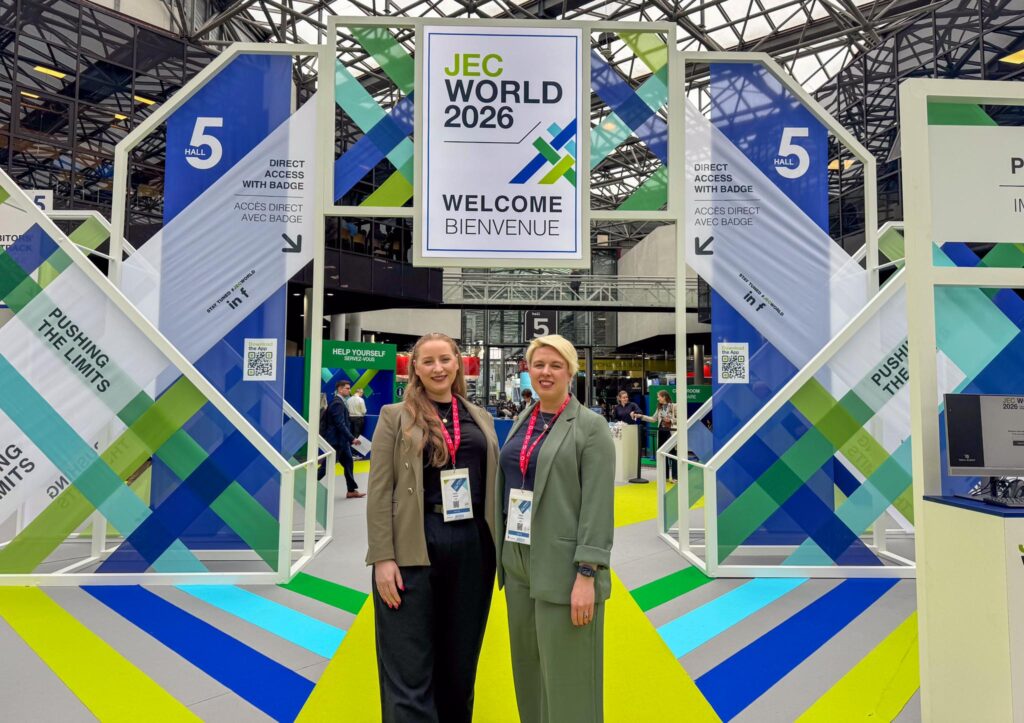 Lios co-founders stand in front of JEC World 2026 sign.